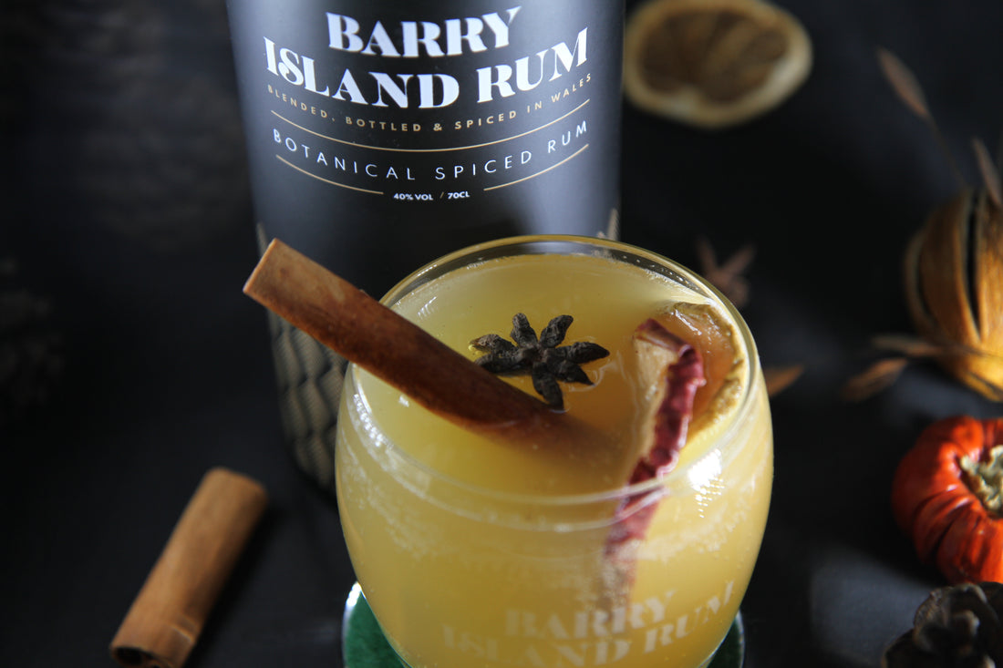 Barry Island Spiced Rum Cooler cocktail and a bottle of Barry Island Rum