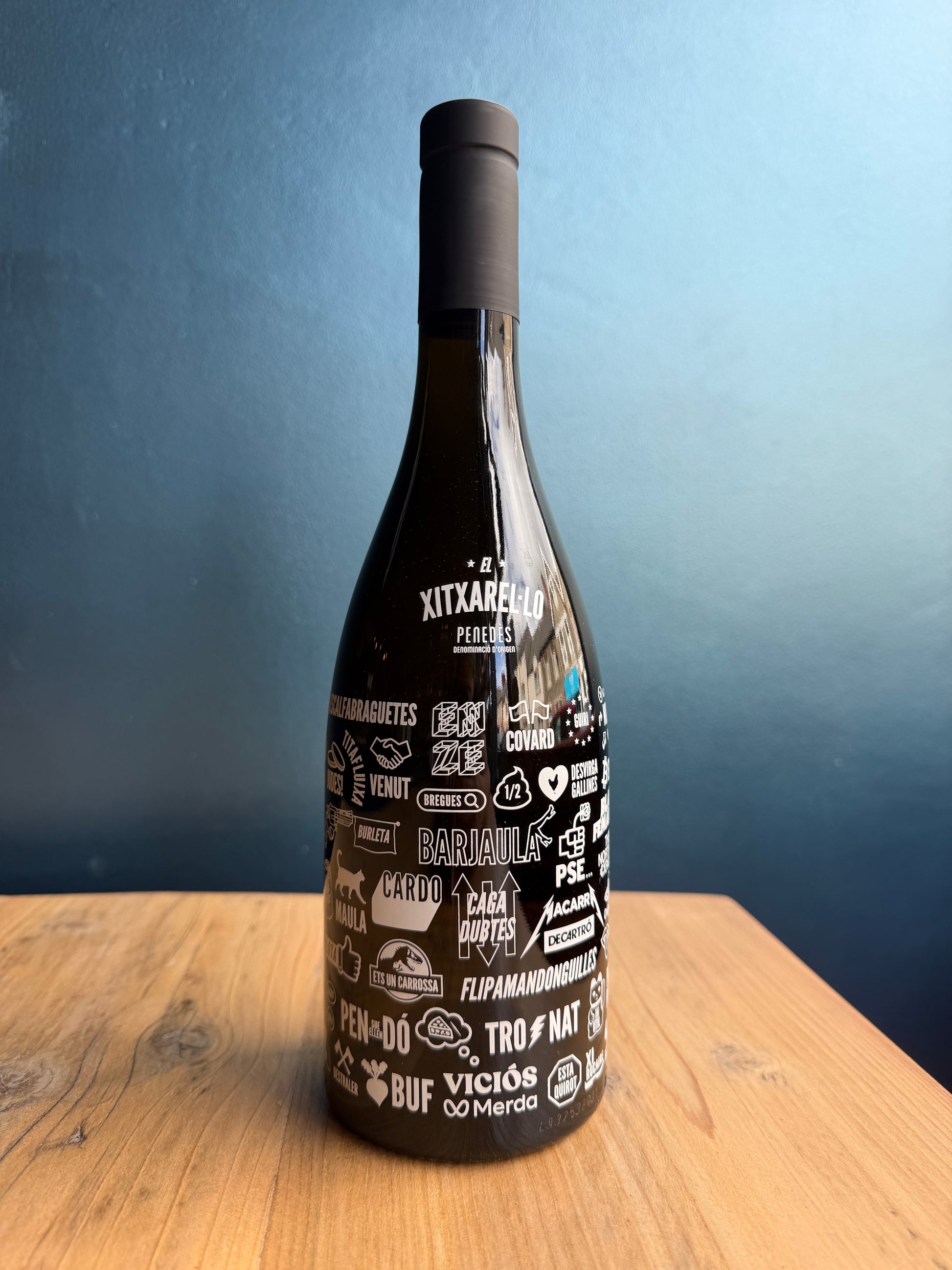 A bottle of Can Virgili El Xitxarel·lo organic Spanish white wine on a table at Mor by Barry Island Spirits wine bar and wine shop in the vale of glamorgan