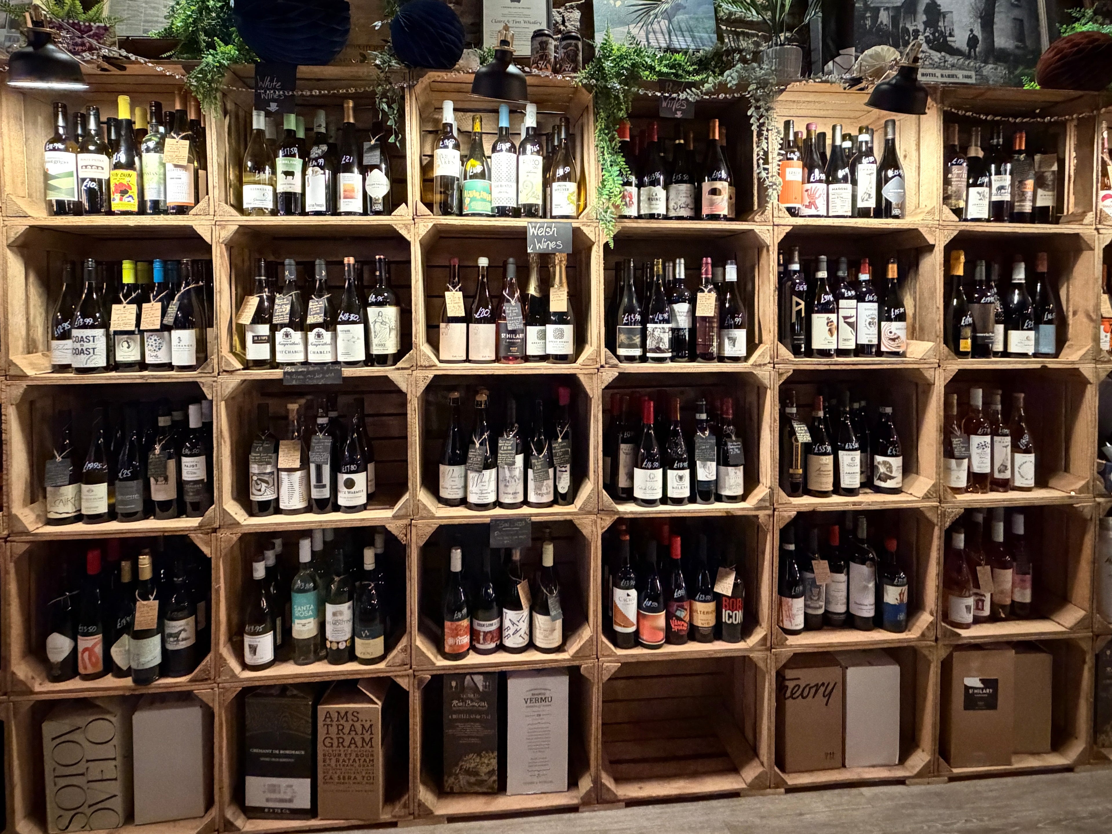 Fully stocked shelves containing lots of bottles of wine at Mor wine bar and Shop in Barry, Vale of Glamorgan